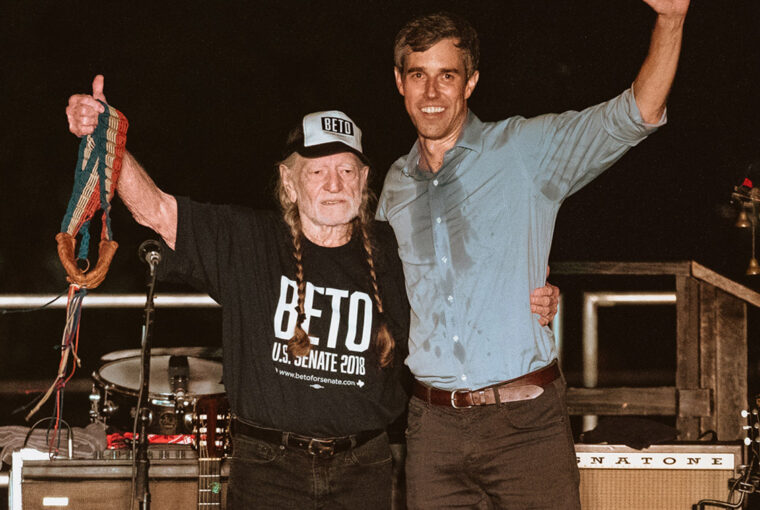 A man and woman standing next to each other.