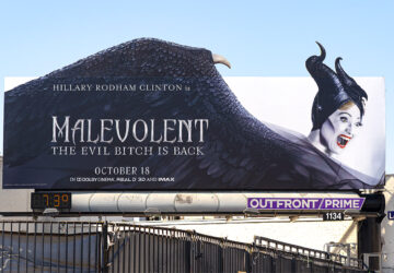 A billboard for the movie malevolent.