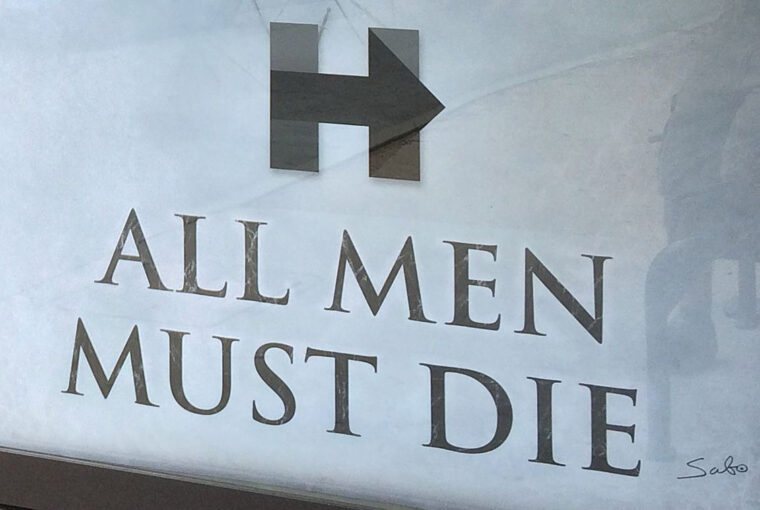 A sign that reads " all men must die ".