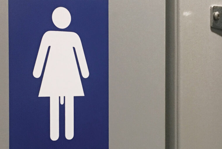 A blue and white sign with a woman 's image.