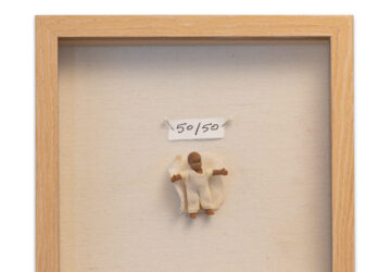 A picture of a person in a frame with the price tag 5 0 / 5 0.