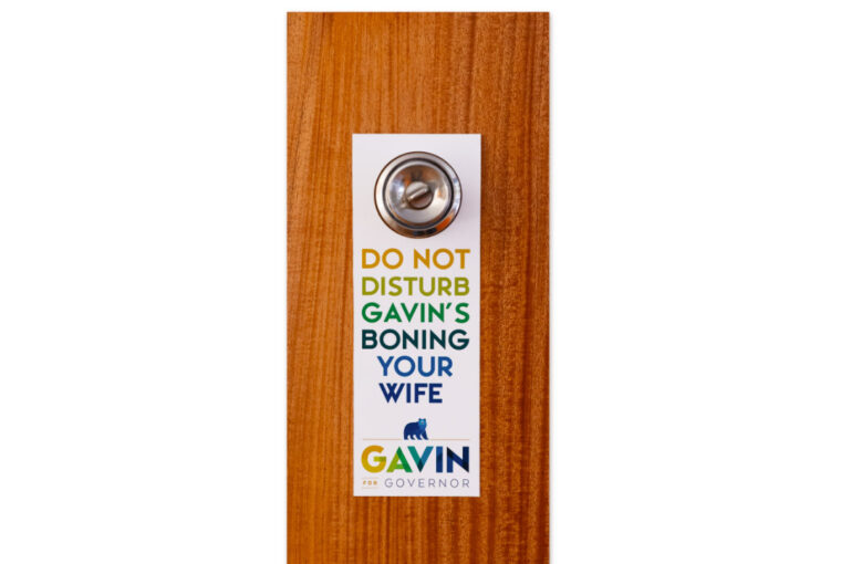 A door knob with a sticker on it.