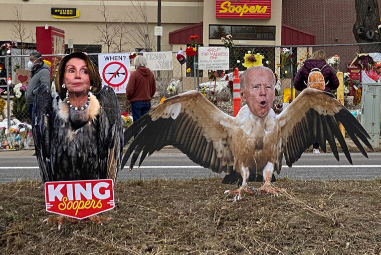 A couple of cardboard cut outs of people with wings.