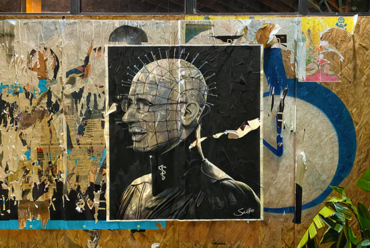 A large painting of a man with a head on it.